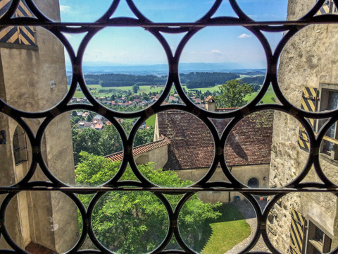 The castle courtyard and views over the countryside from the passage connecting the central keep to the chapel at Waldburg Castle, Germany.