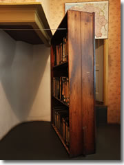 A bookcase swung aside to reveal teh hidden staircase up to the apartment where Anne Frank hid with her family from the Nazi occupation of Amsterdam