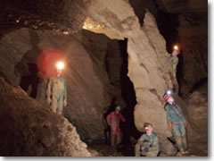 Philly Grotto members admire a natural bridge in a private cave in West Virginia.