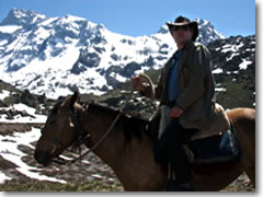 The author astride Canella high in the Andes Mountains of Chile.