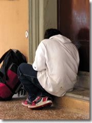 An addict in a doorway in Bolgona, Italy