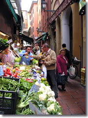The street market on Via Drapperie in Bologna, Italy