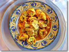 Enzo's excellent tortelloni (pasta pillows stuffed with spinach and ricotta cheese and smothered in fresh tomoato sauce) at U Bossu in Taormina, Sicily, Italy.