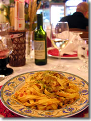 Enzo's tagliatelle alla mafiosa (a noodle dish with pisachios, cream, tomatoes, pancetta, and mushrooms) at U Bossu in Taormina, Sicily, Italy