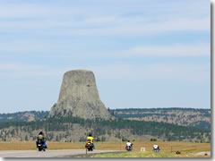 Motorcycles en route to the Sturgis Rally roar past Devils Tower in Wyoming