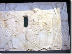 A relief showing the Virgin Mary, St. Andrew, and TK