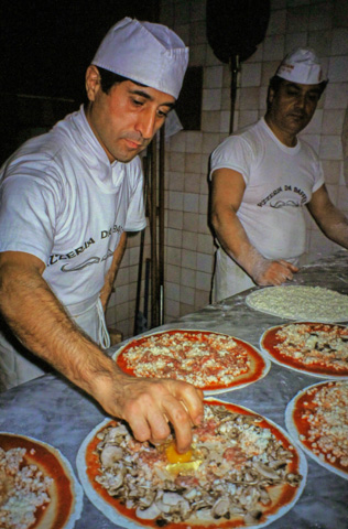 Making a capriciosa at Pizzeria Da Baffetto, Rome