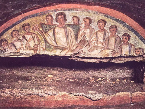 A burial niche in the Catacombs of San Domitilla with a fresco of a young Christ teaching his disciples