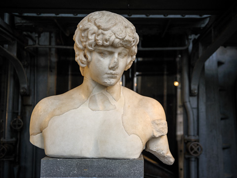 A bust of Antinous (Antinoo), Emperor Hadrian's beloved boy toy who drowned in the Nile at age 19 and was deified by the grieving emperor; in Rome's Art Center Acea - Centrale Montemartini