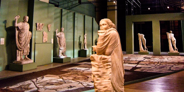 Ancient Roman sculptures inside the Centrale Montemartini, including Polimnia