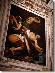 Caravaggio's "Crucifixion of St. Peter" (1602) in Rome's Santa Maria del Popolo