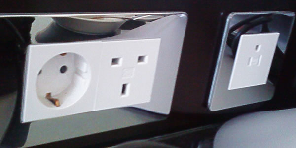 A variety of outlets in a hotel room
