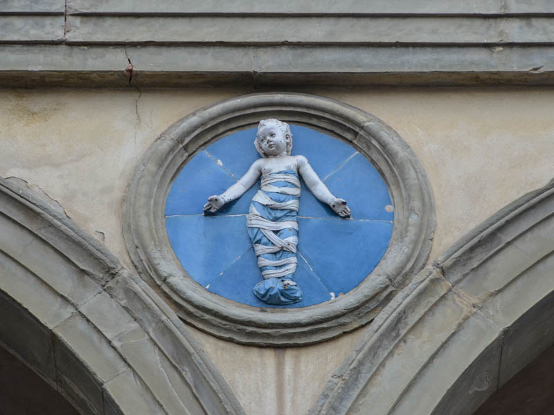 A Luca della Robbia terracotta tondo on the Sepdale degli Innocenti, Florence. (Photo by Richard Mortel)