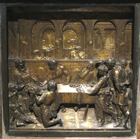 The Banquet Feast of Herod by Donatello (1427) on the baptisaml font in Siena's Battistero