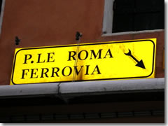 Yellow directional signs in Venice